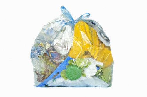 Van loading commercial waste on Kilburn street outside shop