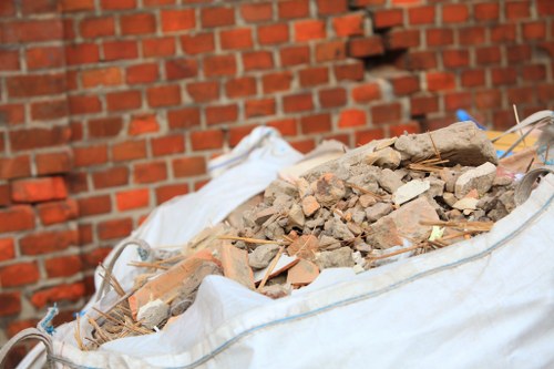 Construction site with organized builders waste clearance in Kilburn