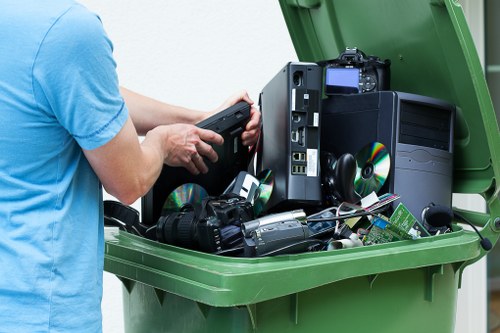 Workers sorting recyclable materials at a collection point
